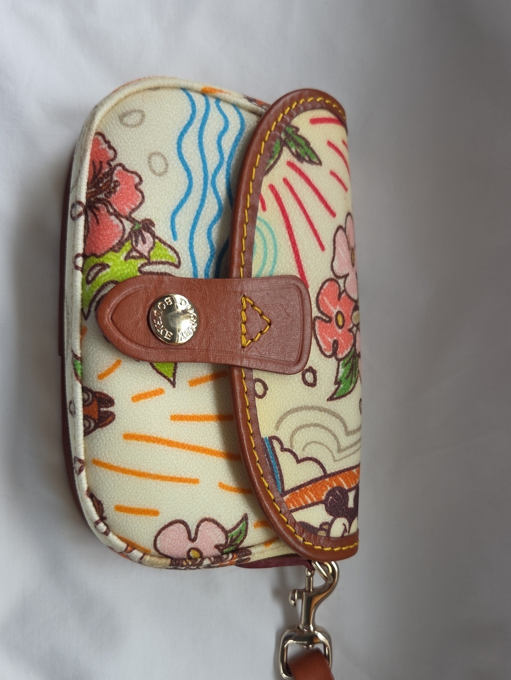 Dooney & Bourke Cream Floral Canvas Wristlet with Brown Leather Trim